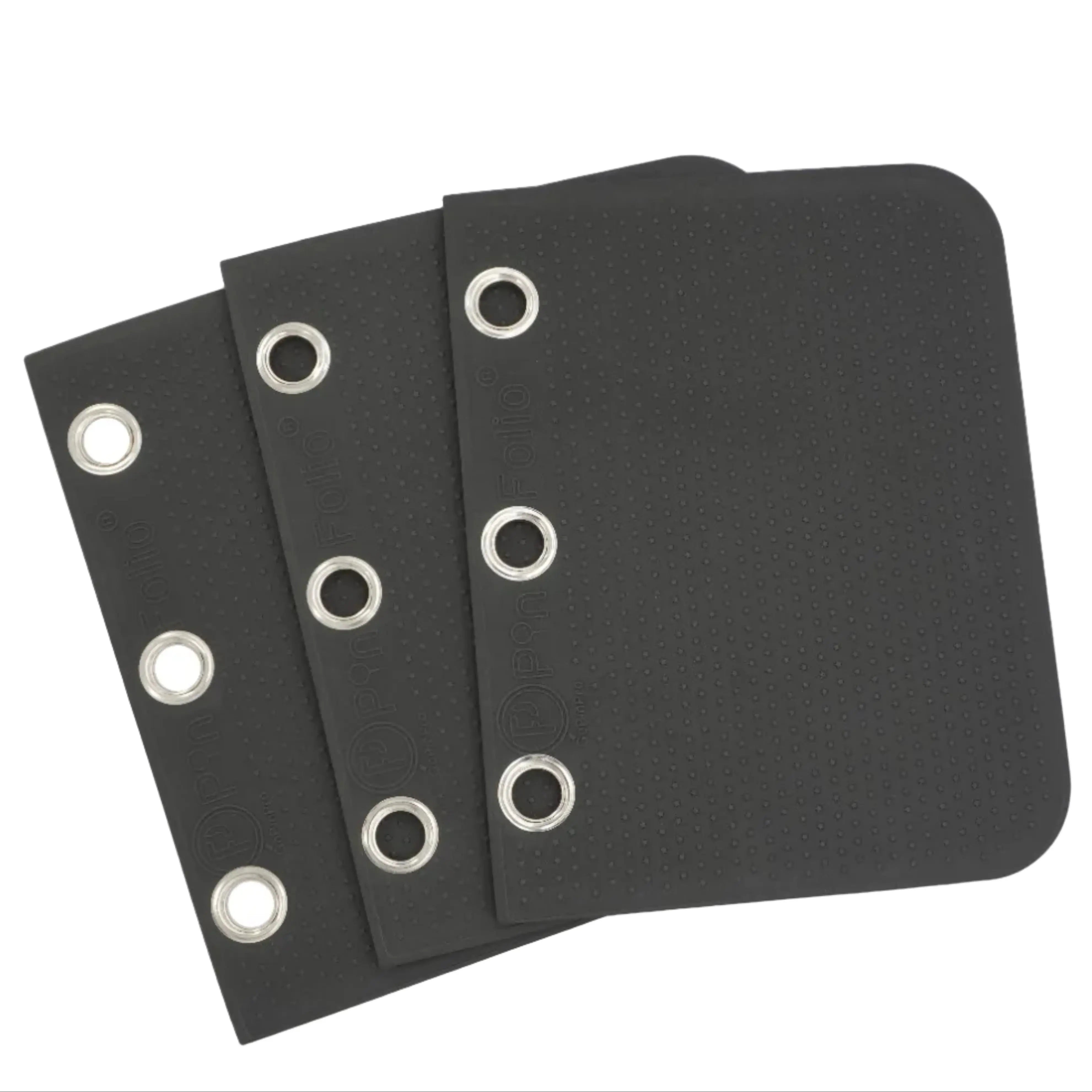 Three black rectangular fabric or leather-like panels with rounded corners and metal grommets, arranged overlapping on a light gray background.