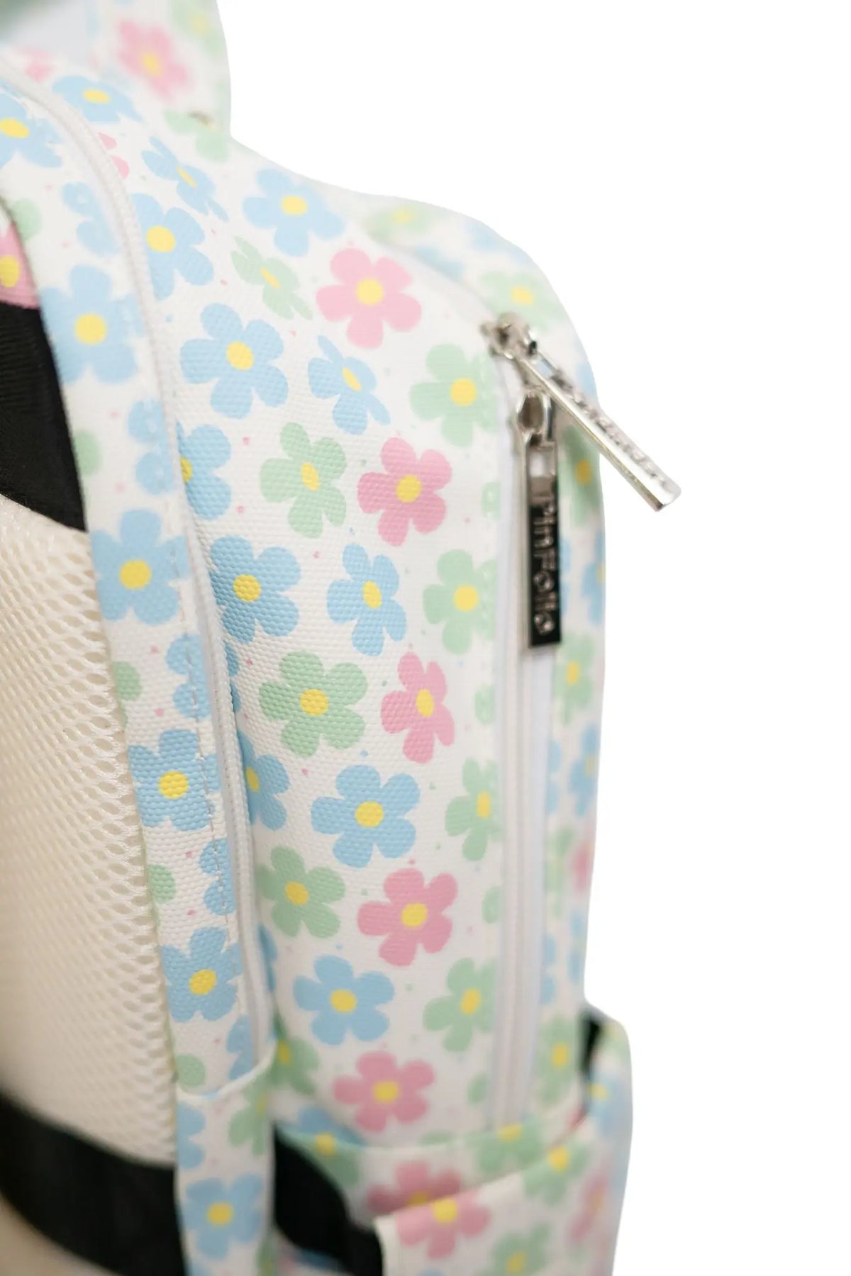 Close-up of the PinFolio® Backpack Daisy print side pocket