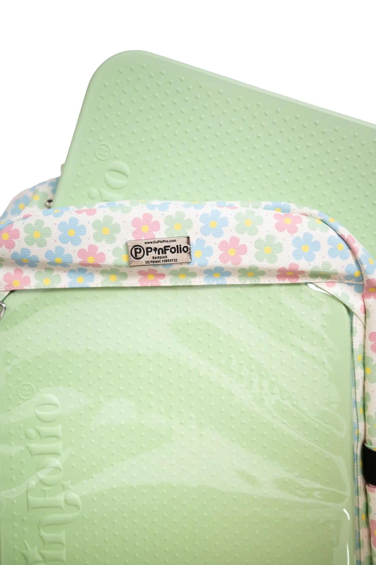 Close-up of the green Stick'N'Go® front board in the PinFolio® Backpack